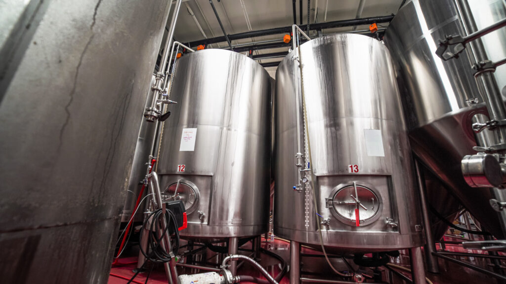 Large silver steel tanks in a brewery