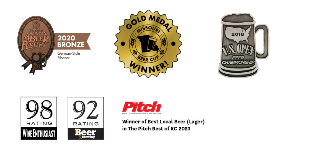 A collage of award and medal logos for Pure Pils, including a bronze medal from the Great American Beer Festival in 2020, a Gold Medal in Missouri Beer Cup, a 98 rating from Wine Enthusiast, a 92 rating from Craft Beer & Brewing magazine, and Best Local Lager in The Pitch Best of KC 2023